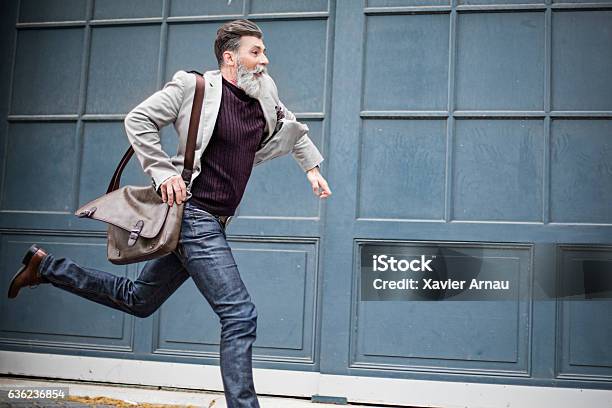 Mature Businessman Rushing To Work Stock Photo - Download Image Now - Urgency, Checking the Time, Running