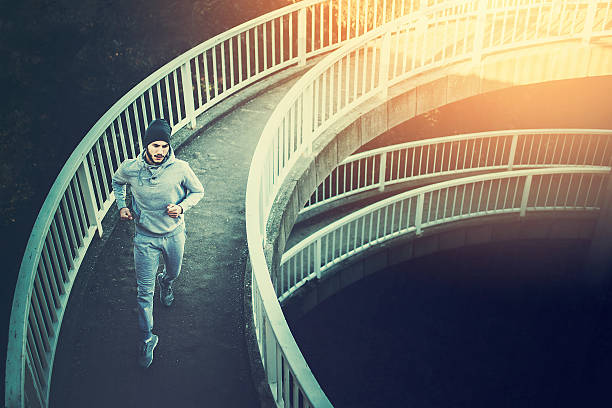 istock Man urban runner having intensive training outdoors in morning 636237748