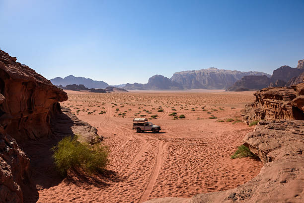 istock Pick up on a desert path, in wadi Rum, Jordan 636238208
