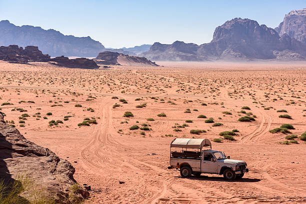 istock Pick up on a desert path, in wadi Rum, Jordan 636238316