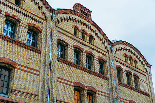 istock old brick factory building in low angle view 636239188