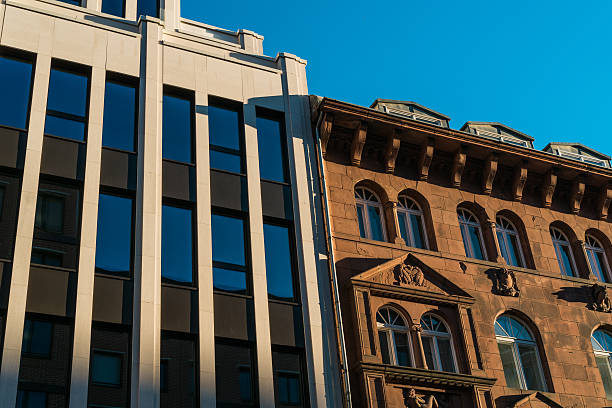 istock old and modern buildings next to each other 636239236