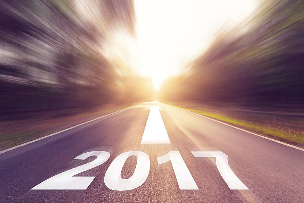 istock Motion blurred empty asphalt road and New year 2017 concept. 636239250