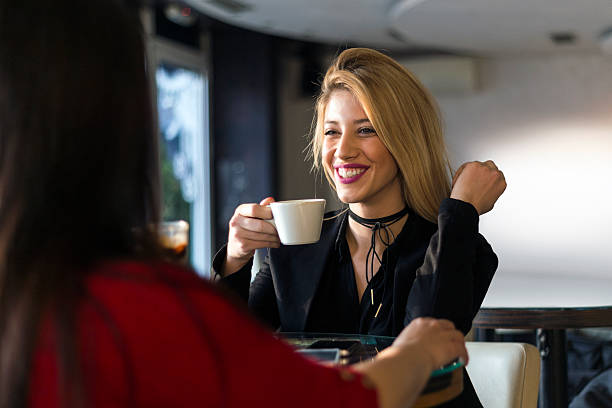 istock Smiling girl with coffee 636239288