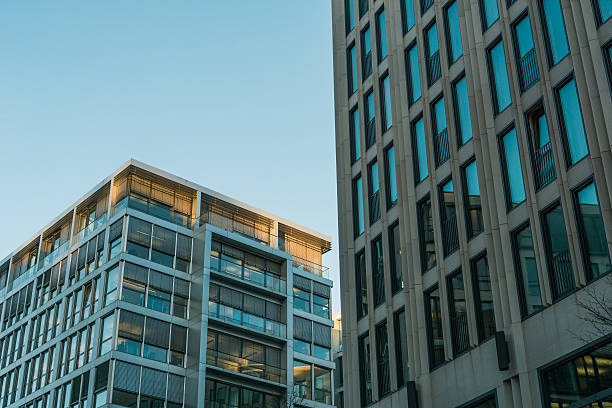 istock modern office buildings with big and small windows 636240050