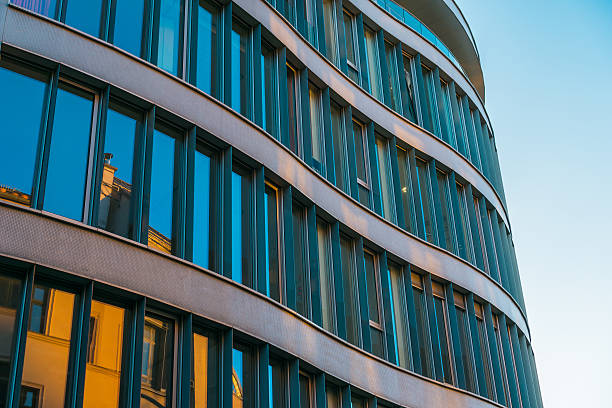 istock modern office building with waves and lines on the facade 636240278