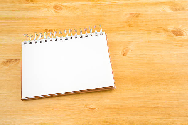istock Notebook on the wooden background 636242806