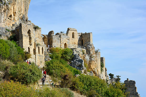 Cyprus, Kyrenia Kyrenia, Cyprus - October 17, 2015: Unidentified tourists by sightseeing of impressive medieval fortress of St. Hilarion kyrenia photos stock pictures, royalty-free photos & images