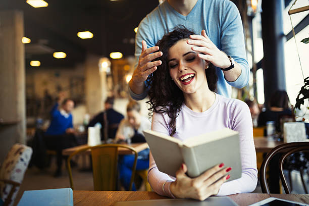 istock Happy couple studying in library 636246386