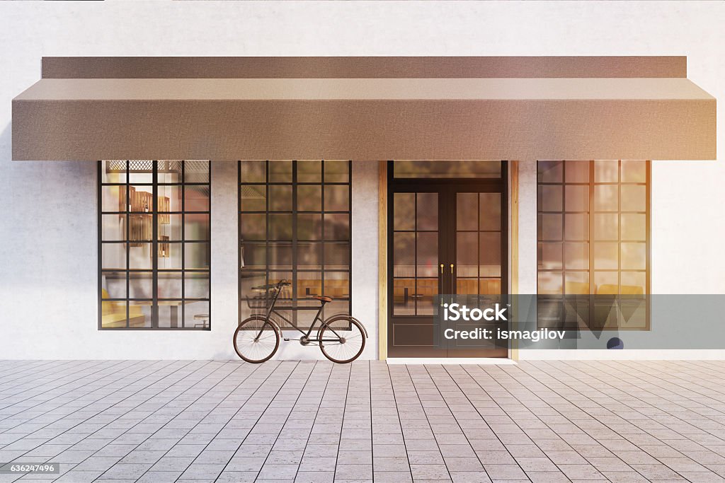 Cafe entrance, toned Front view of a cafe entrance with large windows  and a bicycle near the door. 3d rendering. Mock up. Toned image Cafe Stock Photo