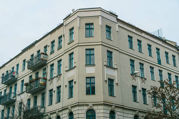 istock white corner house with blue windows 636248058