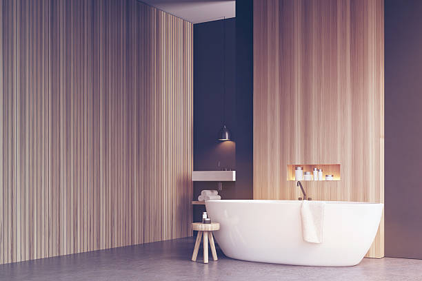 istock Bathroom corner with bathtub and wooden wall Toned 636248112
