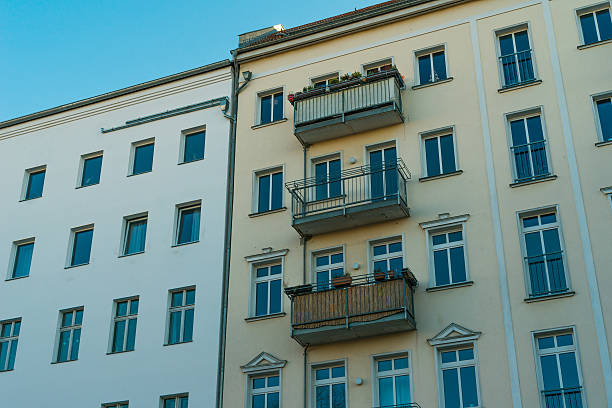 istock white and yellow facaded apartment houses at berlin 636248206