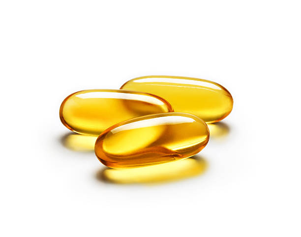istock Omega 3 capsule isolated on white background 636250194