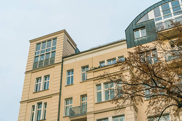 istock residential building with orange facade 636252064