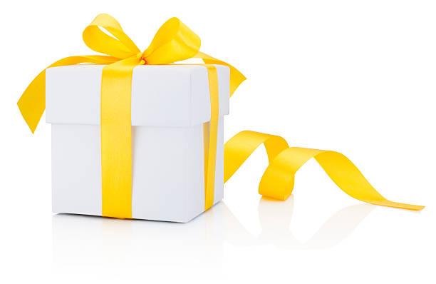 istock White gift box tied yellow ribbon bow Isolated on white 636253558