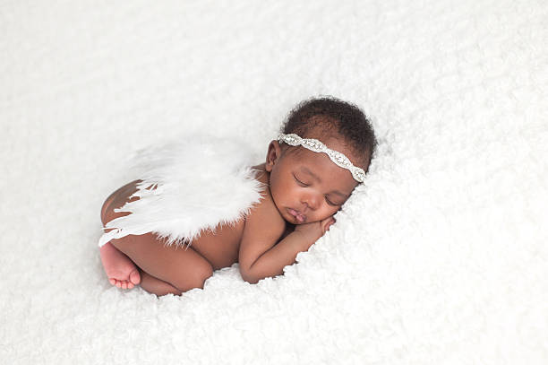 Newborn Baby Girl Wearing Angel Wings stock photo