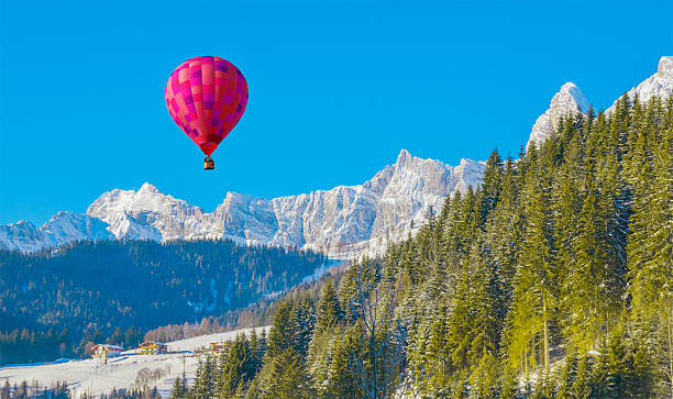 Mountain landscape with an air balloon stock photo