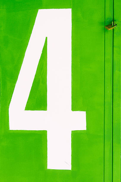 istock Green closed gate with padlock with a white number 4 636254888