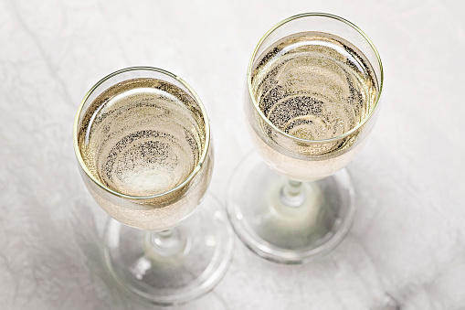 two glasses of champagne in a close-up top view.