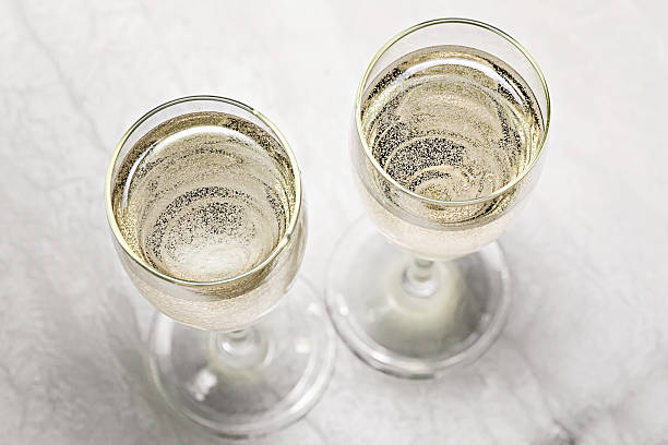 two glasses of champagne in a close-up top view stock photo