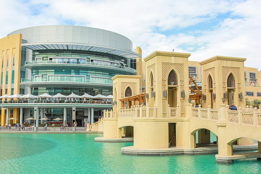 Dubai, United Arab Emirates - May 1, 2013: close up of the bridge that connects the Dubai Mall to Souk Al Bahar in the Burj Khalifa Lake. The area of the Burj Khalifa is famous for the shopping.