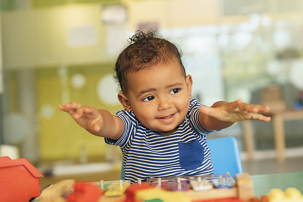istock Happy baby playing with toy blocks. 636259238