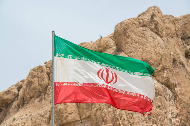 Flag of Iran in front of Persepolis stock photo