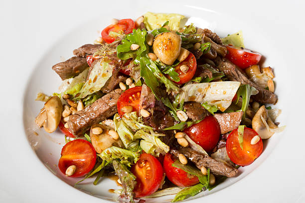 istock Sliced pork in salad 636260754
