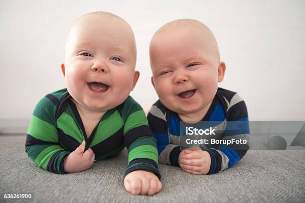 Identical Twins Laughing Stock Photo - Download Image Now - Baby - Human Age, Twin, Laughing