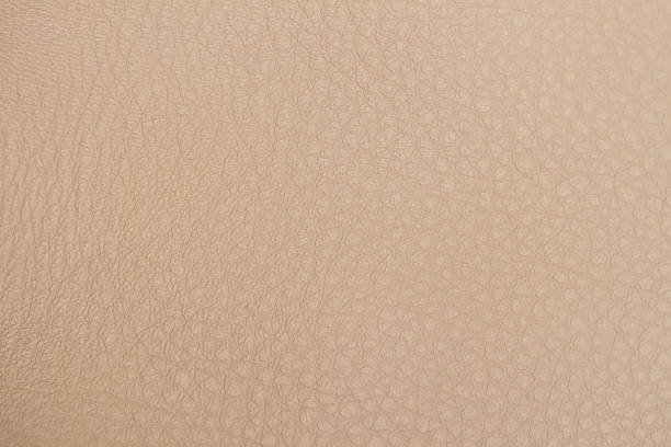 istock Texture of genuine leather close-up, cowhide, background. Hazelnut 636262786