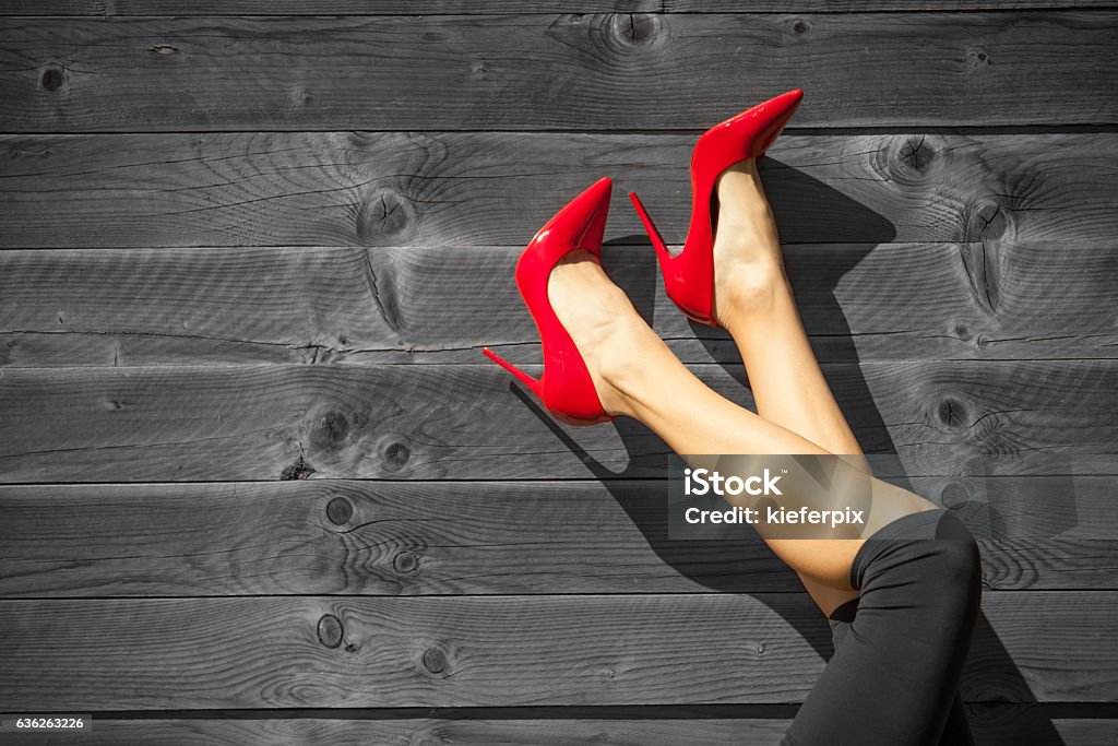 Perfect female legs Sexy women's legs in red high heels.  High Heels Stock Photo