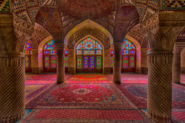 Inside the Nasir ol Molk Mosque in Shiraz, Iran Interior with beautiful and artistic windows with stained glass inside the Nasir ol Molk Mosque (also "Pink Mosque) in Shiraz, Iran. The Nasir ol Molk Mosque is one of the main sights of Shiraz. The mosque was built during the Qajar era between 1876 and 1888.The nickname "Pink Mosque" is going back to the considerable pink color tiles for its interior design.  persian culture stock pictures, royalty-free photos & images