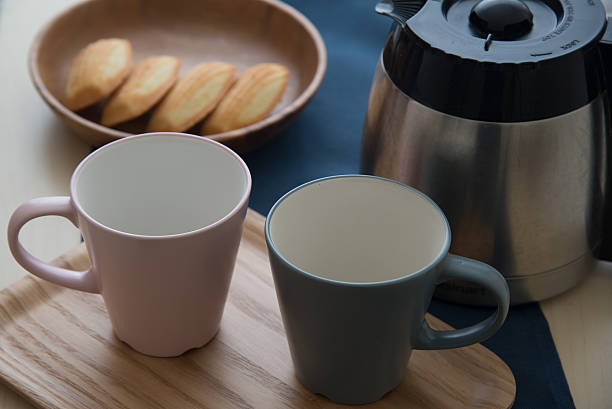 istock pair of mug and coffee pot 636263516