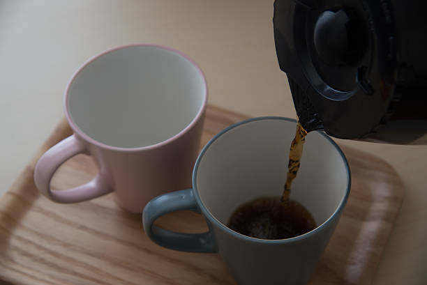 istock pair of mug and coffee pot 636263574