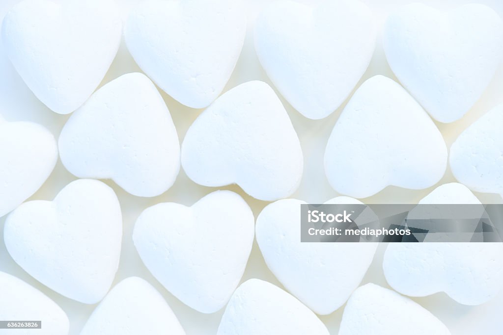 Heart-shaped decorations Close-up of white heart-shaped marshmallows White Color Stock Photo