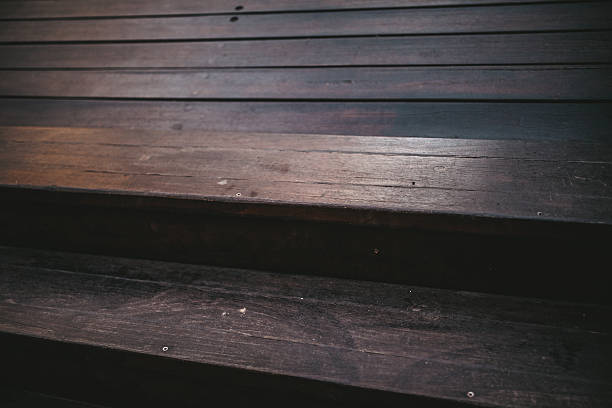 istock Dark wood stairs 636264258