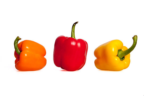 istock Orange, Red and Yellow Peppers on white background. 636264378