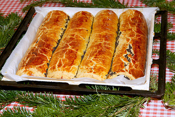Homemade traditional poppy seed and walnut rolls for christmas holiday. Tradition hungarian christmas cake name is beigli or bejgli. My mother's beautiful christmas cake with her own hands