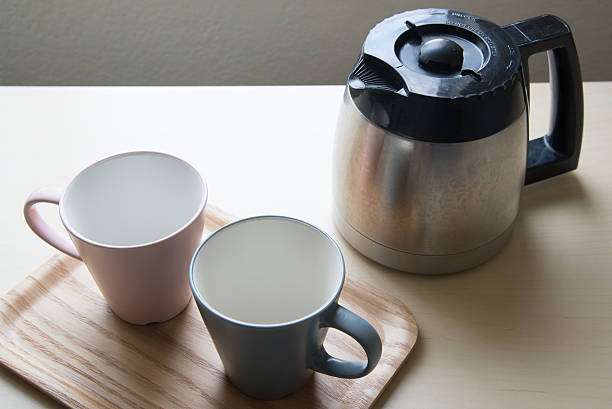 istock pair of mug and coffee pot 636265264