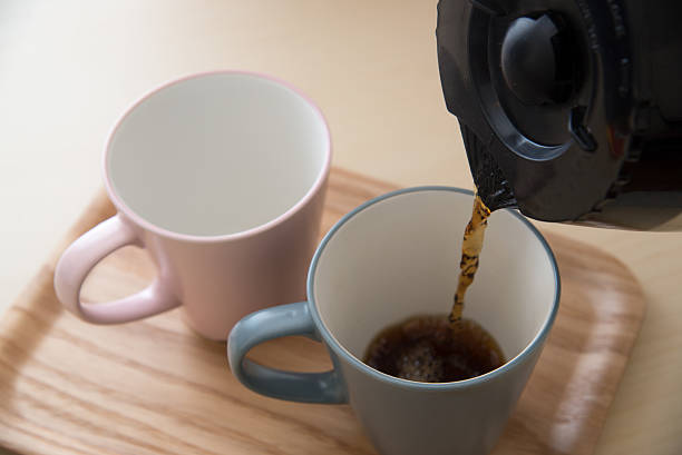 istock pair of mug and coffee pot 636265358