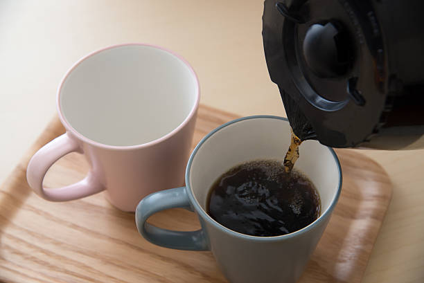 istock pair of mug and coffee pot 636265426