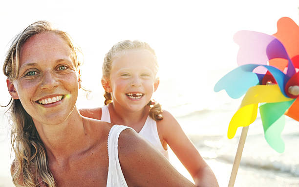 istock Mother Daughter Fun Happiness Beach Bonding Concept 636267986