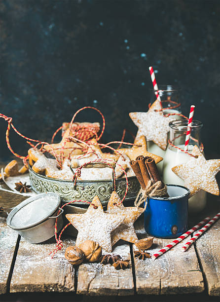 christmas cookies, decoration rope, nuts, spices, milk, sugar powder - milk milk bottle drinking straw cookie imagens e fotografias de stock