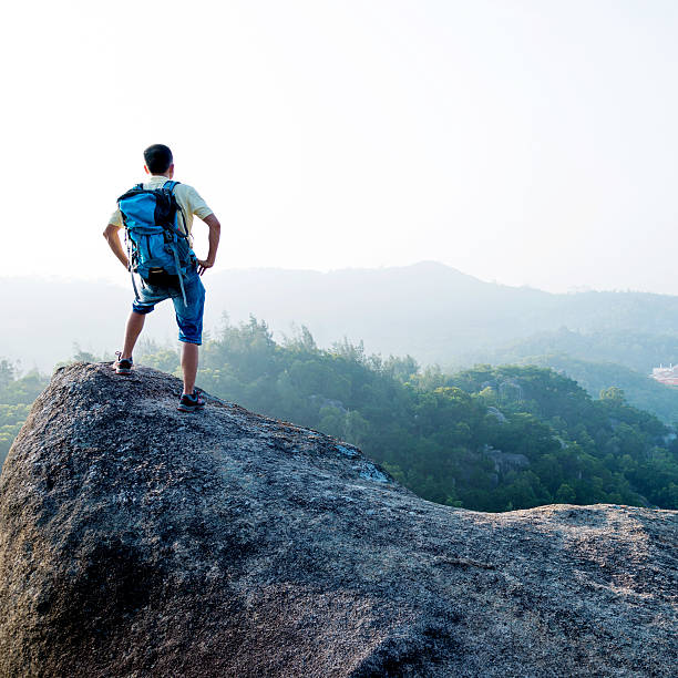 istock Male hiker standing on a rock 636269694