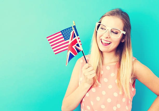 Woman with flags of English speaking countries Young woman with flags of English speaking countries usa england stock pictures, royalty-free photos & images