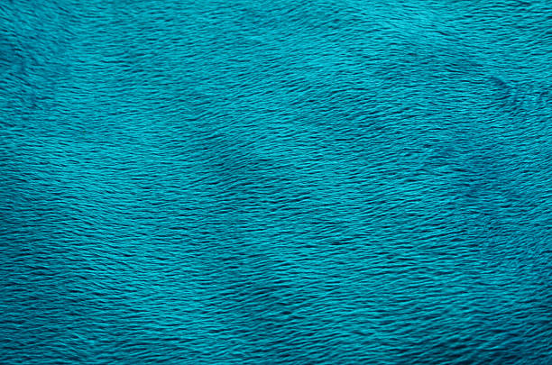istock Turquoise color fabric carpet background 636275606