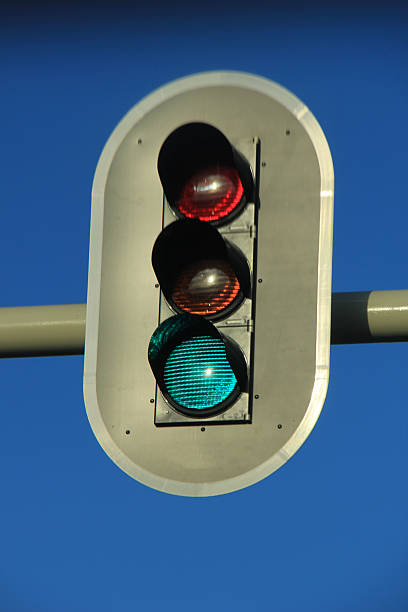 istock Traffic lights in a clear blue sky 636276304
