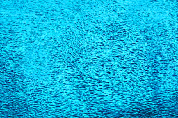 istock Turquoise color fabric carpet background 636277322