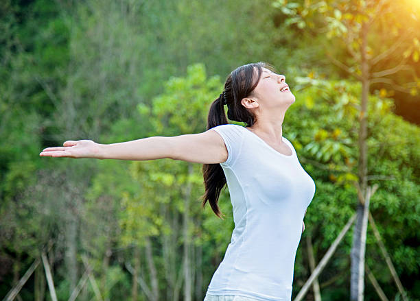 istock Beautiful asian woman enjoying fresh air 636277730